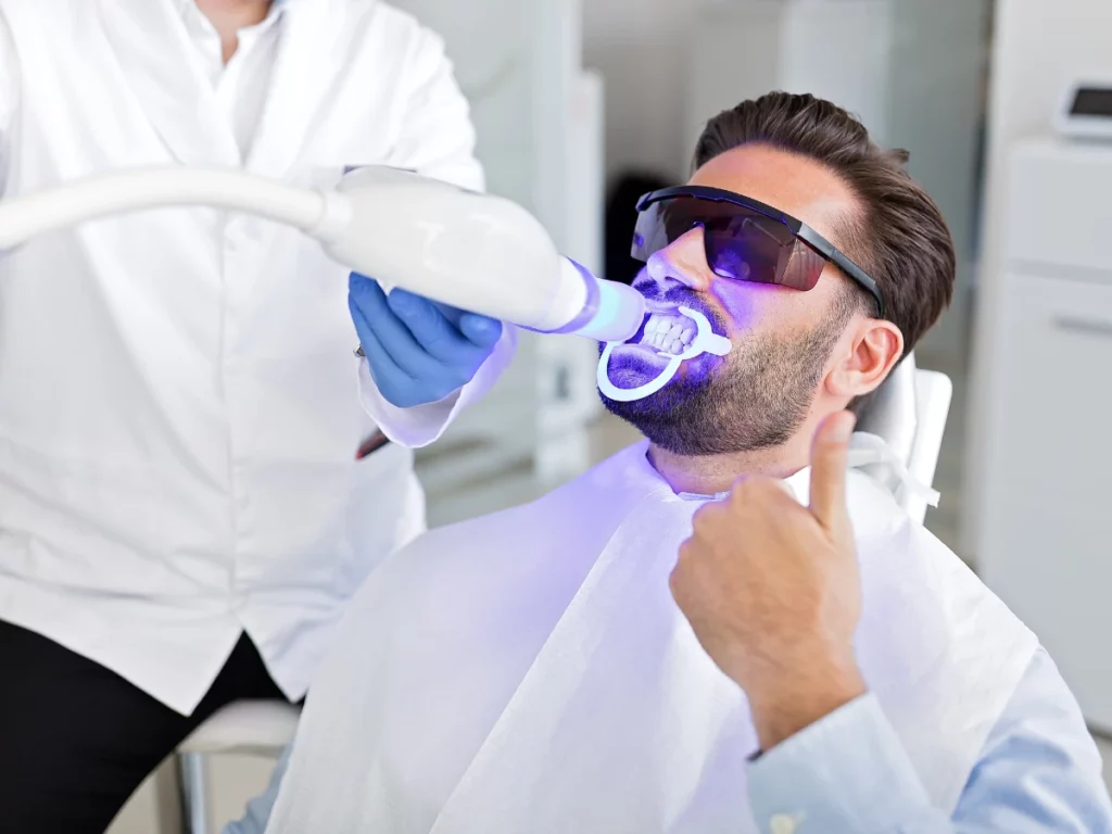 Man undergoing teeth whitening procedure